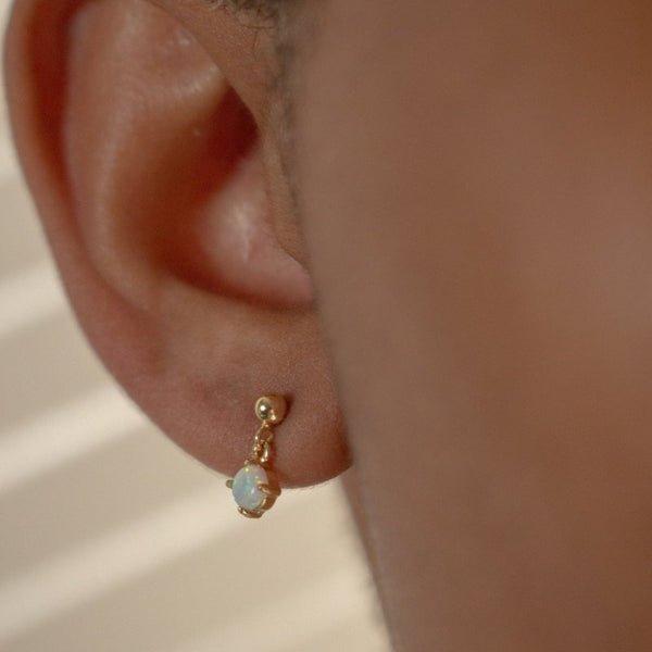 Alexa Drop Stud Earrings// 14k Gold Vermeil x White Opal on woman's ear