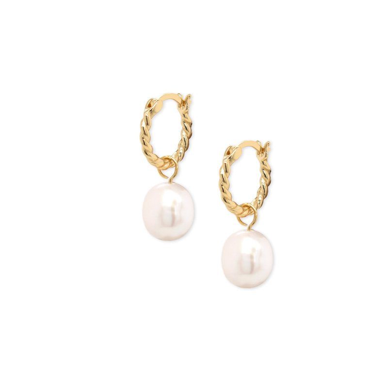 Gold hoop earrings with pearl drops on a white background