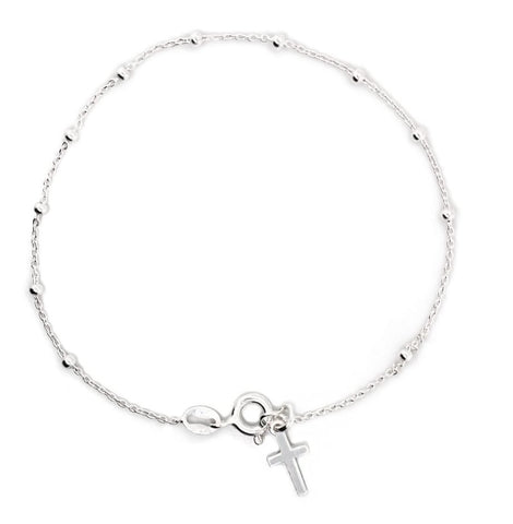 Silver bracelet with a cross charm on a white background