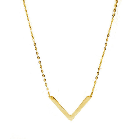 Gold V-shaped necklace on a white background