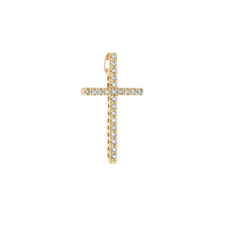 Gold cross pendant with embedded cubic zirconia on a white background