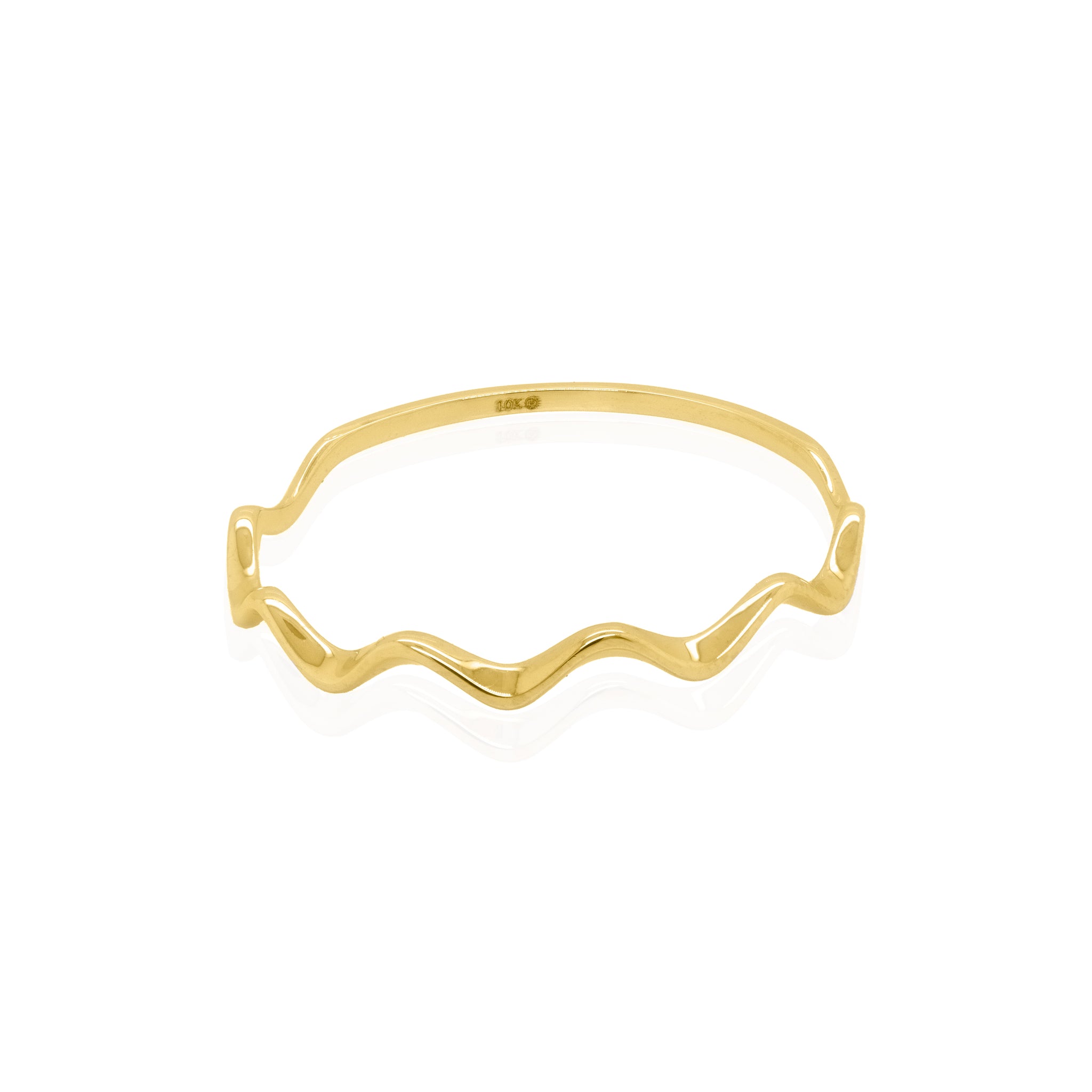 Gold ring with wavy design on a white background