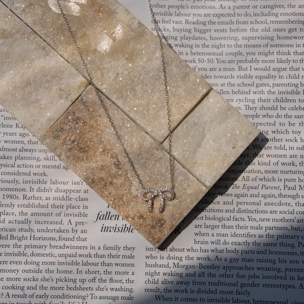 Necklace with a pendant on a textured surface