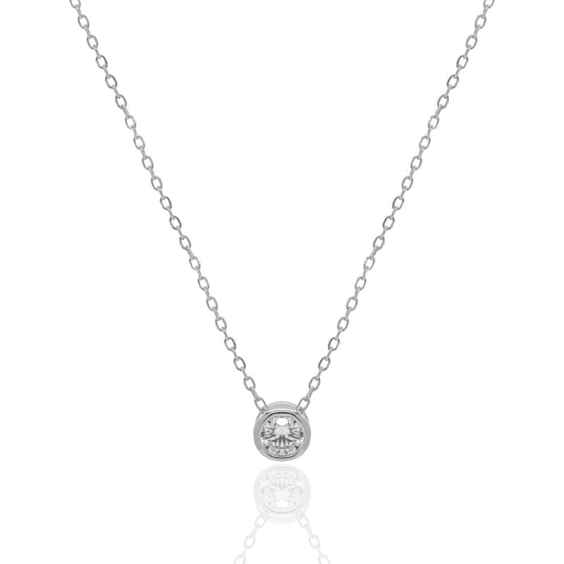 Silver necklace with a small round diamond bezel pendant on a white background