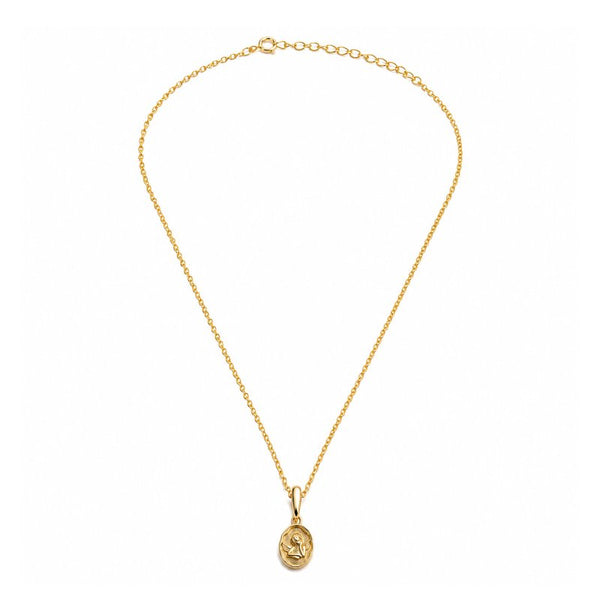 A delicate gold chain necklace with a small oval pendant featuring an embossed religious design, displayed against a solid white background.