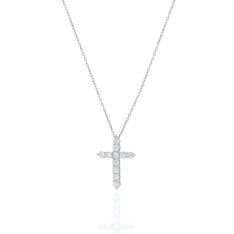 Diamond cross necklace on a white background