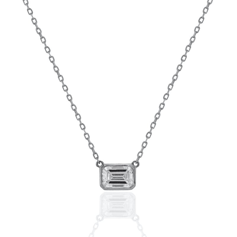 Diamond necklace with emerald-cut pendant on a white background