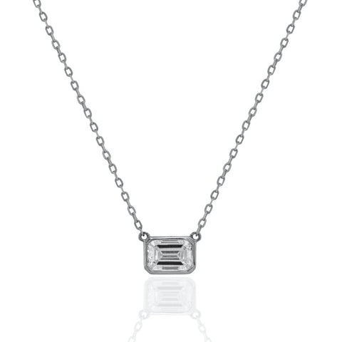 Diamond necklace with emerald-cut pendant on a white background